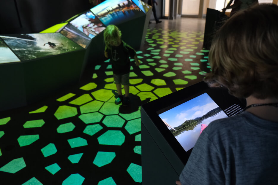 Celebrating biodiversity for Biomuseo Panama when entering museum final colorful gallery visitors and children interact with floor