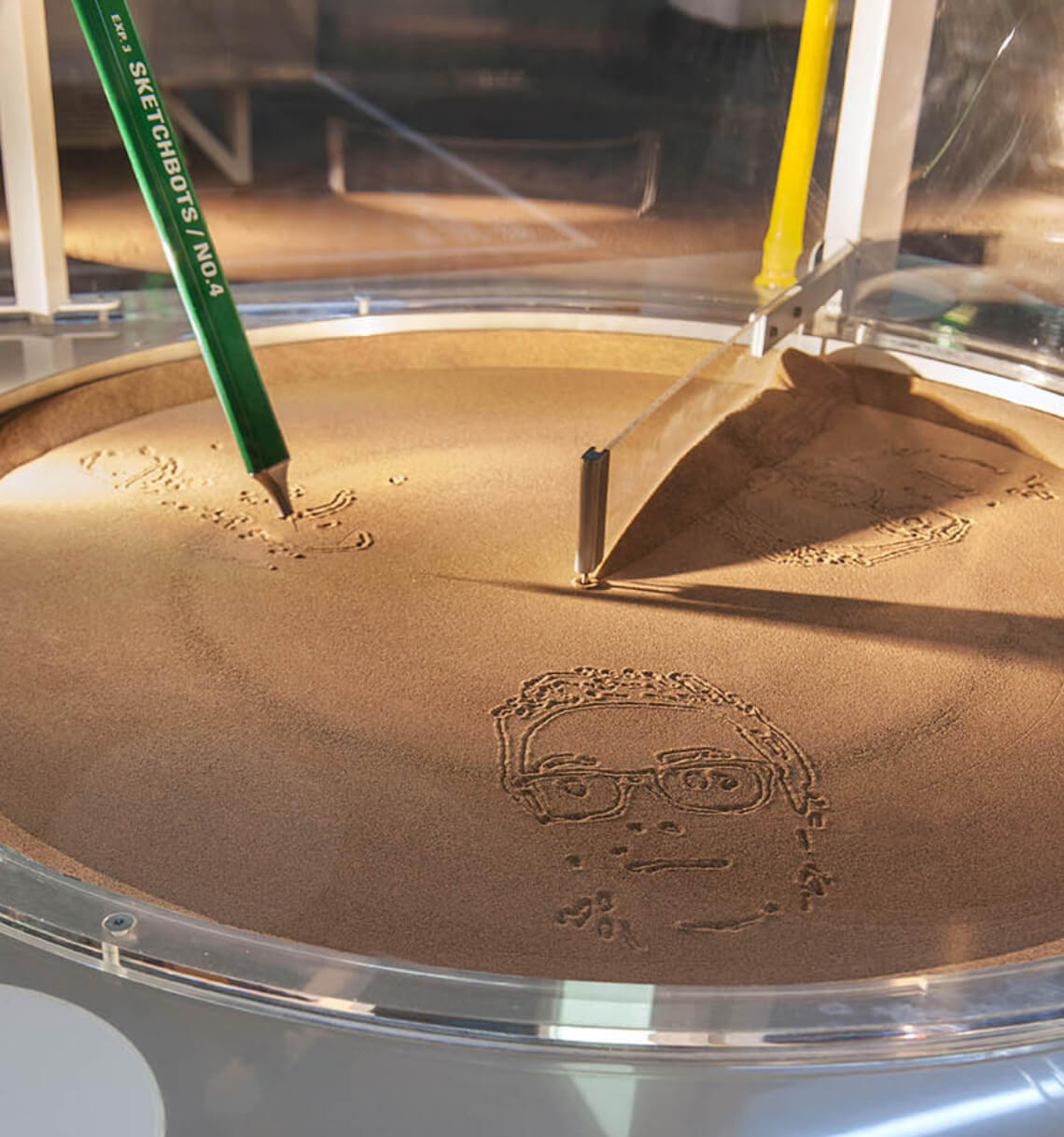 Chrome Web Lab: Making the Internet physical scketchbots sand drawing portrait of visitors exhibition