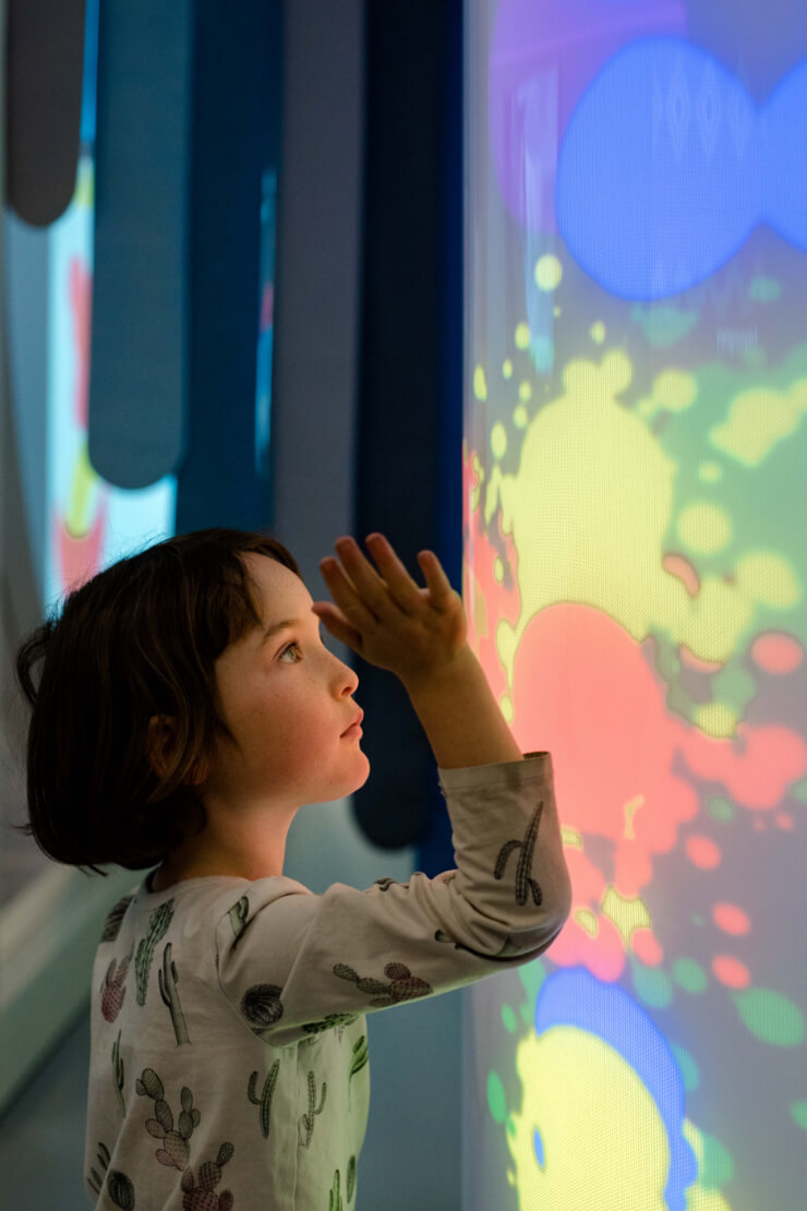 Kids creating with textured tiles and colour at de Young Museum