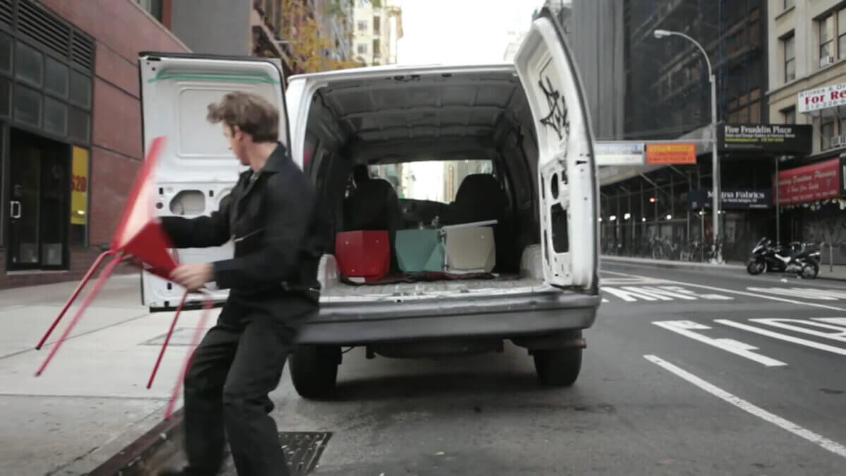 Pulic chairs being placed on the street installation by Tellart