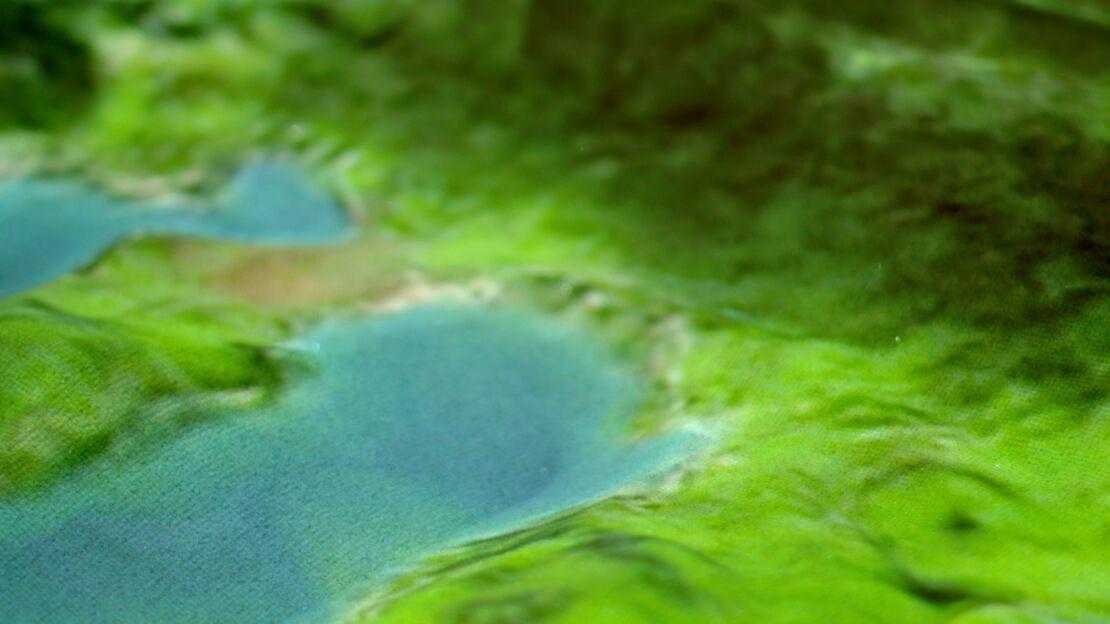 Visitors shaping landscapes with hands in sand